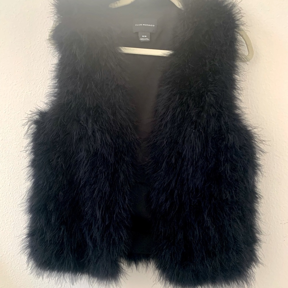 Authentic feather vest to dress up or down.